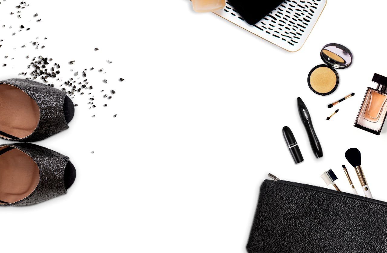 Flat lay of stylish shoes and beauty products, perfect for a fashionable lifestyle theme.